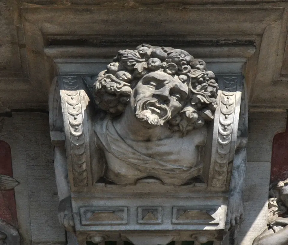 Der Herbst wird von einem &auml;lteren Mann mit Fr&uuml;chten und Weinlaub im Haar verk&ouml;rpert.